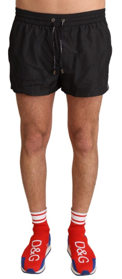 Dolce & Gabbana - Elegant Black KING Motive Swim Trunks